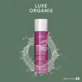 Luxe Organix DermaPRO TXA Melasma Clear 6.0 Exfoliating Toner on army green background with watery texture