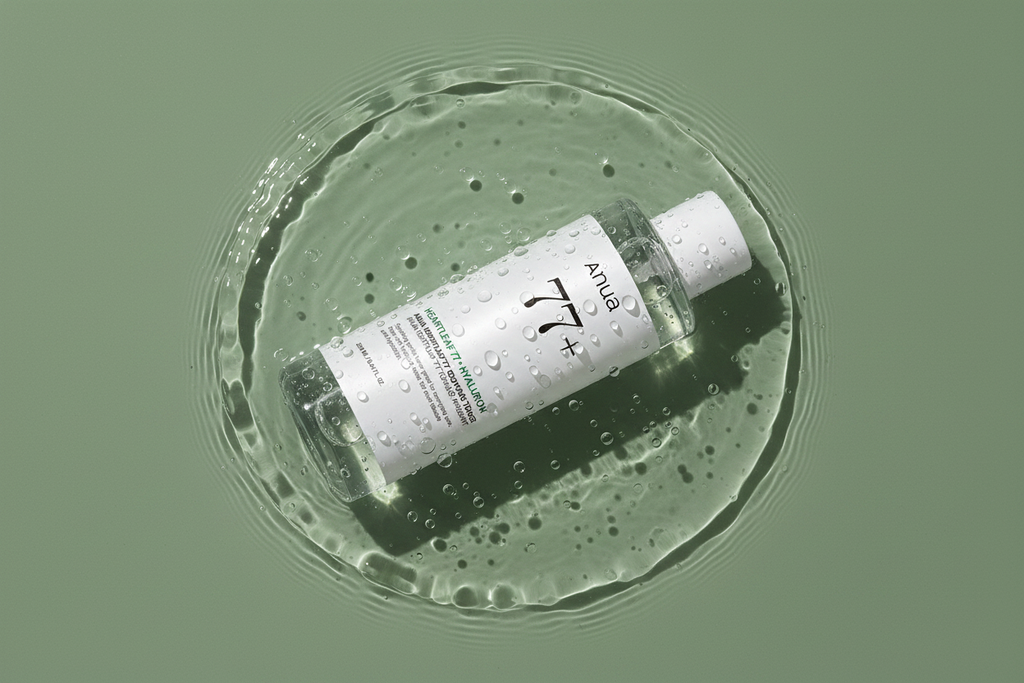 Anua Heartleaf 77+ Soothing Toner bottle lying in water with ripples
