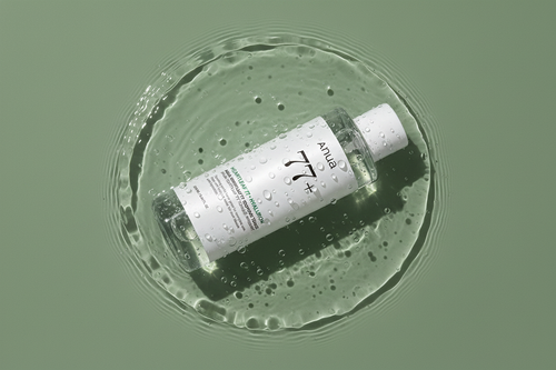 Anua Heartleaf 77+ Soothing Toner bottle lying in water with ripples