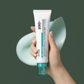 Anua PDRN + Hyaluron Aqua Hyaluronic Acid 100 Moisturizing Cream on army green background with hand
